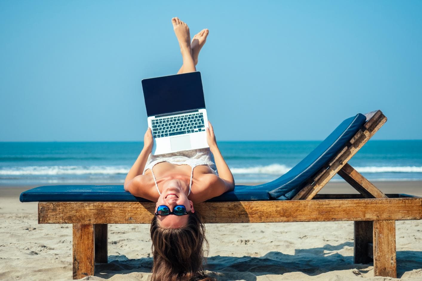 Working from a laptop on the beach