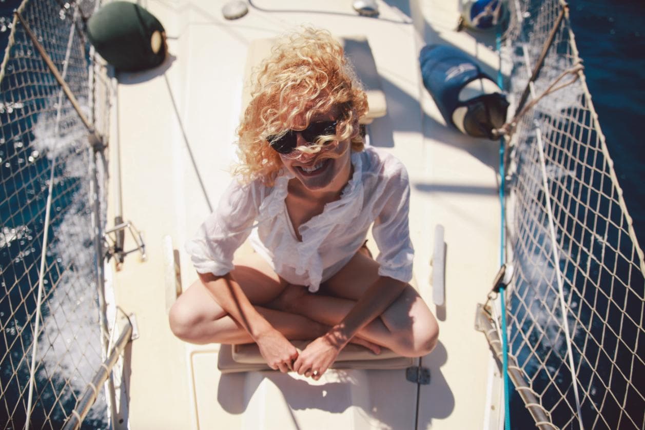 Resort Expert enjoying a sunny boat ride between client calls